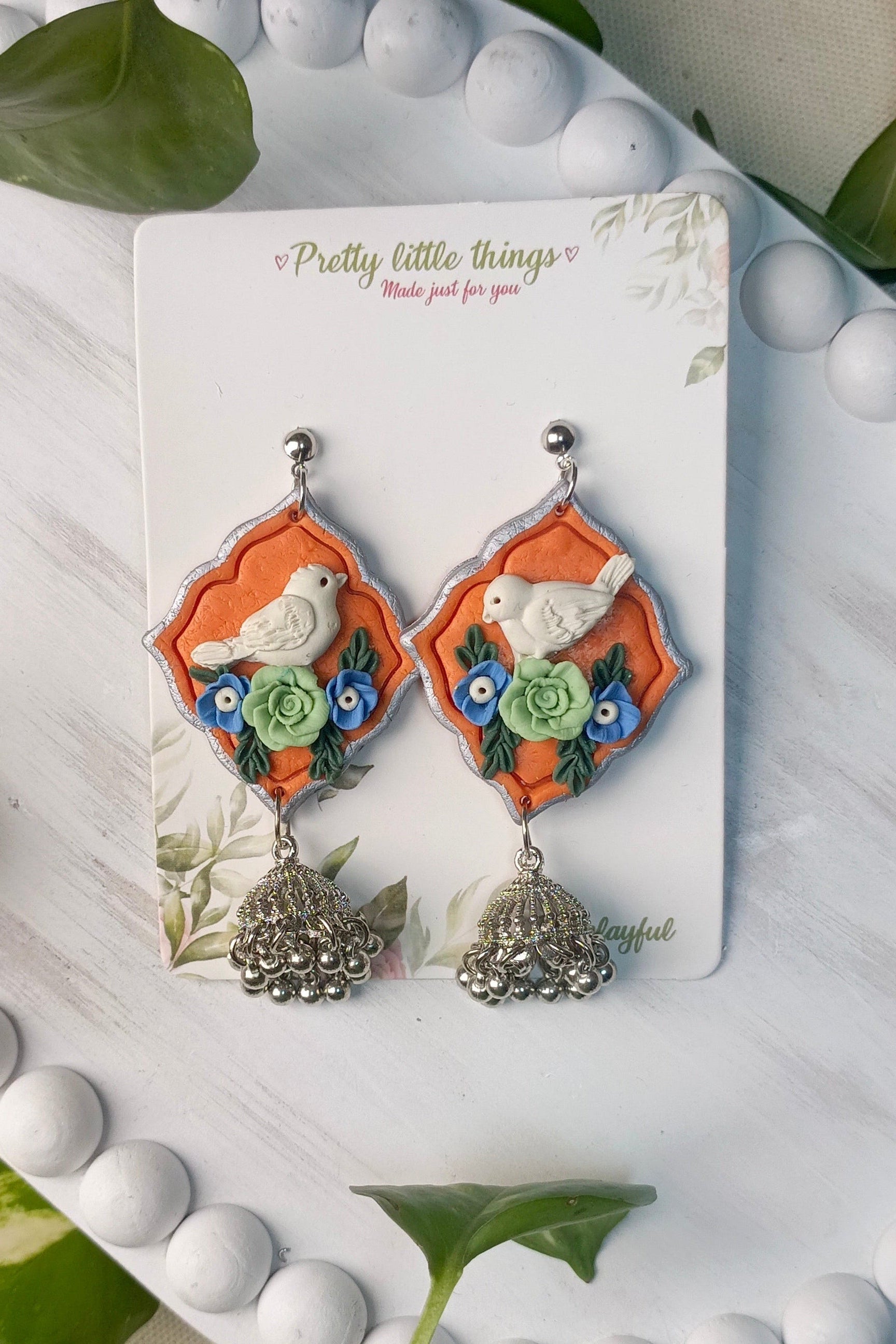 Clayful Ivory Bird Jhumkas