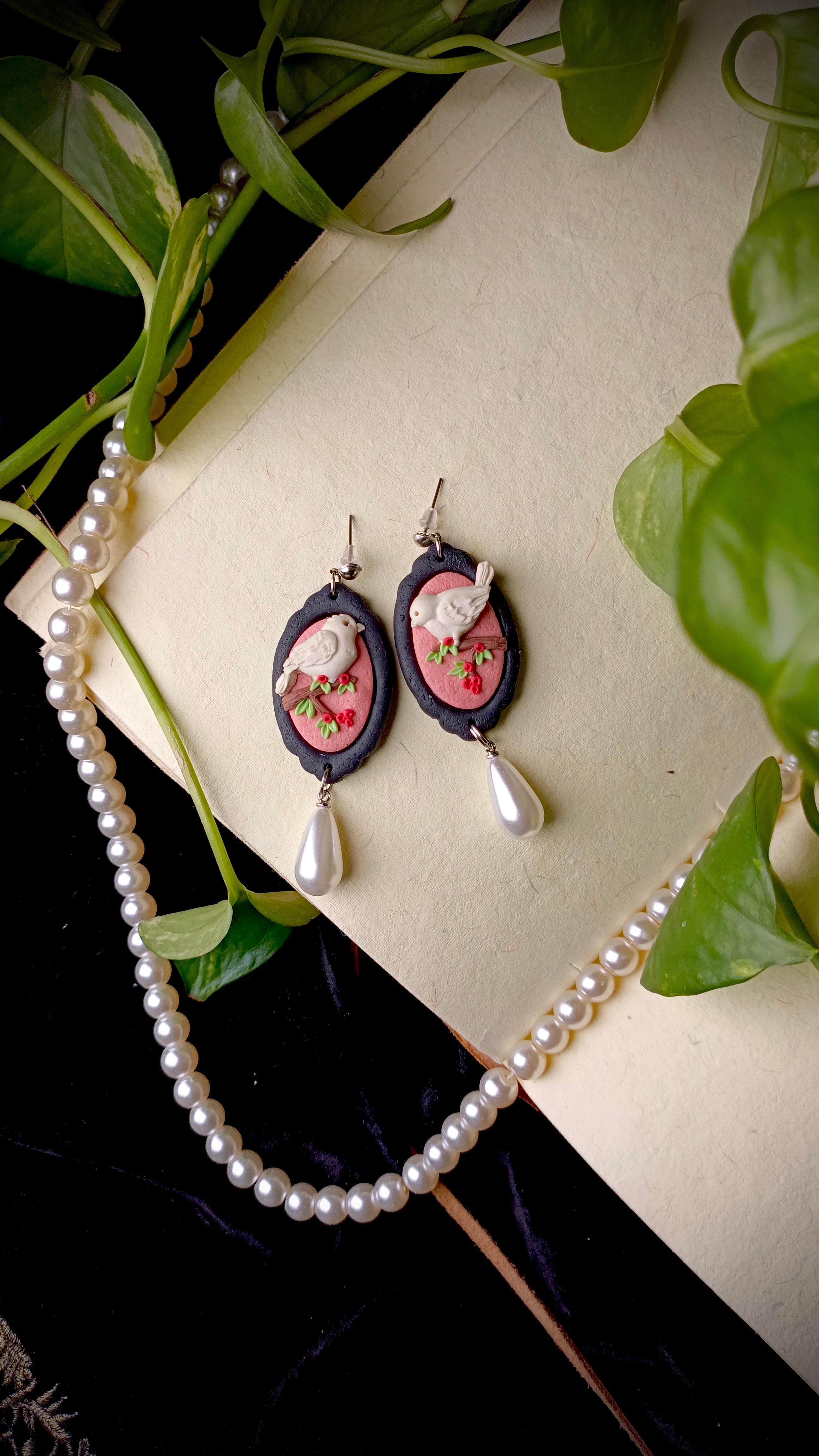 Handmade pearl drop bird earrings