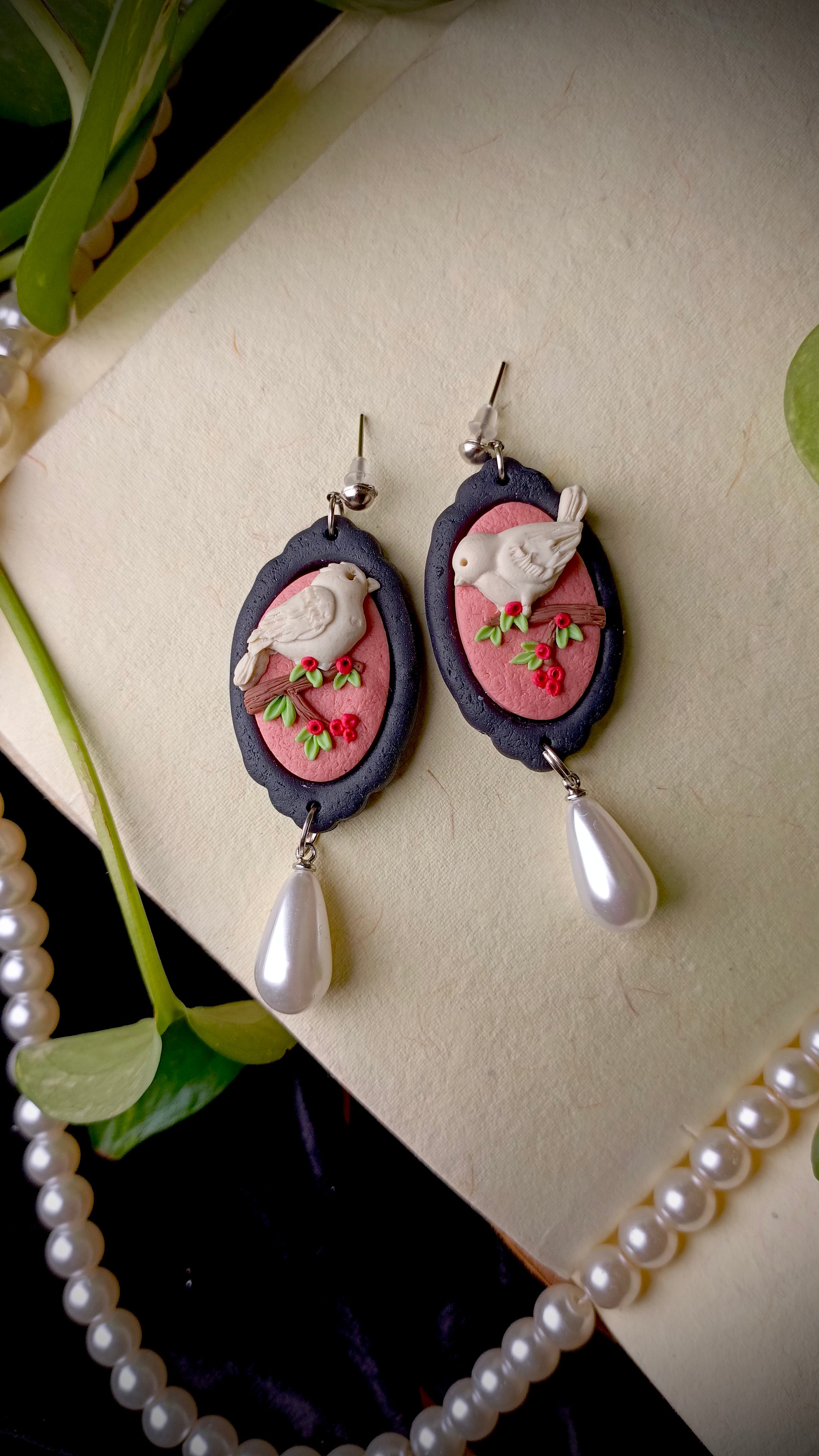 Handmade pearl drop bird earrings